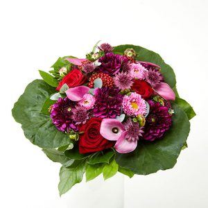 Send blomster - Buket i rødlige nuancer